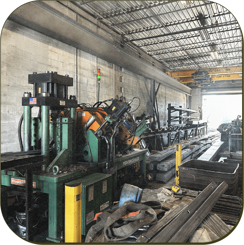 Photo of rail fabrication machinery in a warehouse